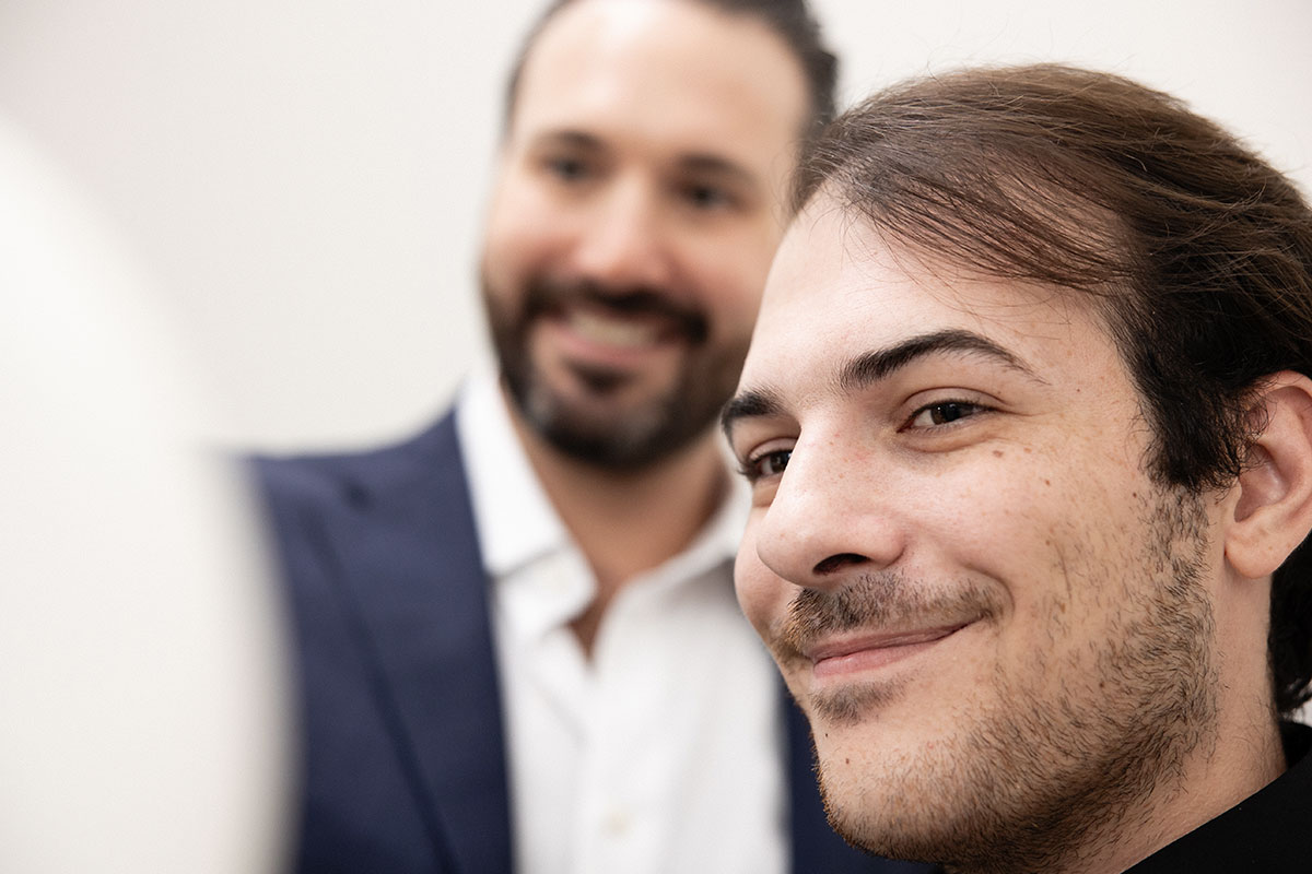 doctor consulting with Delray Beach patient about men's hair restoration procedure