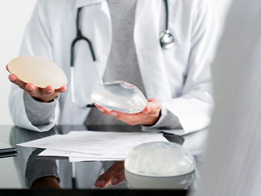 doctor and patient discussing motiva breast implant options in Florida