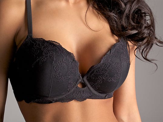 woman in Delray Beach, FL, after her breast lift auto augmentation